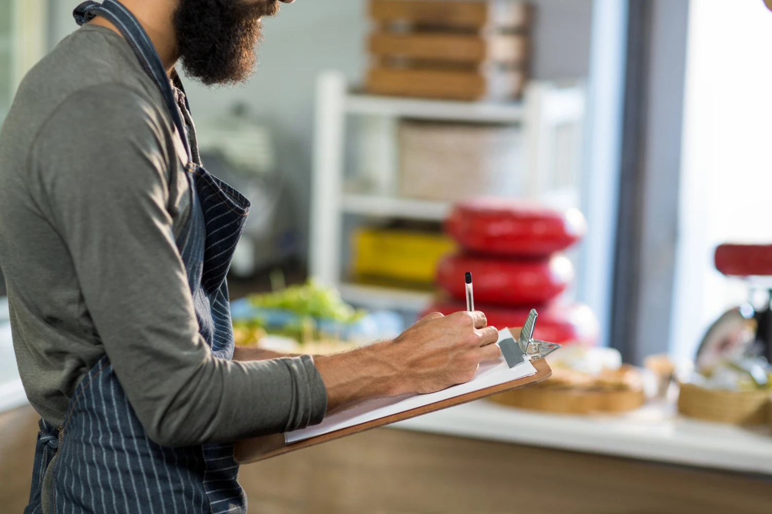 Food Safety Regulations for Restaurants: Restaurant owner checking compliance.